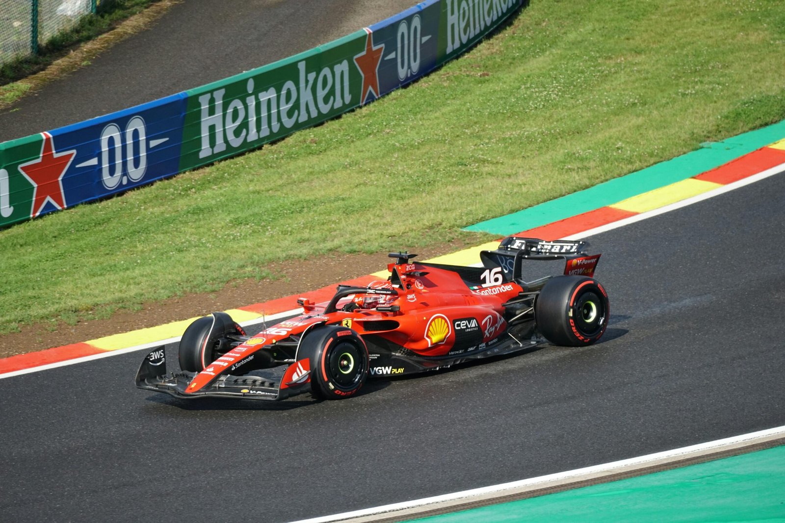 Ferrari Formula 1 car racing on a track during a Grand Prix event.
